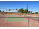 Well-maintained community tennis court featuring a durable surface and a high fence to keep balls in play at 5533 E Decatur St, Mesa, AZ 85205