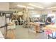 Fully-equipped wood shop with multiple workstations, tools, and equipment for woodworking projects and creative endeavors at 5533 E Decatur St, Mesa, AZ 85205