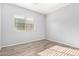 Bedroom featuring wood-look floors and a bright window at 5625 W Euclid Ave, Laveen, AZ 85339