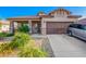 Charming single-story home with a well-manicured desert landscape, covered porch and two car garage at 5625 W Euclid Ave, Laveen, AZ 85339