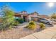 Charming single-story home with a well-manicured desert landscape, covered porch and two car garage at 5625 W Euclid Ave, Laveen, AZ 85339