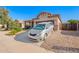 Charming single-story home with a well-manicured desert landscape, covered porch and two car garage at 5625 W Euclid Ave, Laveen, AZ 85339