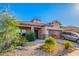 Charming single-story home with a well-manicured desert landscape, covered porch and two car garage at 5625 W Euclid Ave, Laveen, AZ 85339