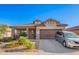 Charming single-story home with a well-manicured desert landscape, covered porch and two car garage at 5625 W Euclid Ave, Laveen, AZ 85339