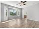 Living room with big windows, ceiling fan and en suite bathroom access at 5625 W Euclid Ave, Laveen, AZ 85339