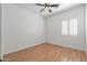 Bedroom with wood floor and shuttered window at 7329 W Tether Trl, Peoria, AZ 85383