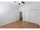 Bedroom with wood floors and double closets at 7329 W Tether Trl, Peoria, AZ 85383