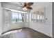 Cozy dining area with a ceiling fan and plantation shutters, next to open kitchen at 7329 W Tether Trl, Peoria, AZ 85383