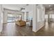 Open-concept living room with tile floors, neutral walls, and sliding doors to the patio at 7329 W Tether Trl, Peoria, AZ 85383