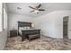 Spacious main bedroom boasts dark wood furniture and tile floors at 7329 W Tether Trl, Peoria, AZ 85383