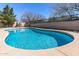 Beautifully shaped pool surrounded by stone and desert landscaping, creating a serene backyard oasis at 7329 W Tether Trl, Peoria, AZ 85383