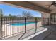 Inviting pool area offers a refreshing escape with a safety fence and views of the surrounding landscape at 7329 W Tether Trl, Peoria, AZ 85383