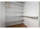 Bright closet is equipped with shelving and wood floors at 8314 N 21St Dr # K108, Phoenix, AZ 85021