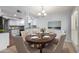 Charming dining room featuring hardwood table, upholstered chairs, and elegant chandelier at 8314 N 21St Dr # K108, Phoenix, AZ 85021