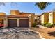 Inviting condo exterior features private garage parking and neutral color scheme for a warm and welcoming curb appeal at 8314 N 21St Dr # K108, Phoenix, AZ 85021