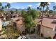 Beautiful aerial shot of condos with desert landscaping, mature trees, and red tile roofs, creating a serene living environment at 9445 N 94Th Pl # 212, Scottsdale, AZ 85258