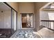 Cozy balcony featuring a patterned rug and sliding glass doors, providing seamless indoor-outdoor living and natural light at 9445 N 94Th Pl # 212, Scottsdale, AZ 85258