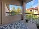 Balcony view with patterned rug looking out to mature landscaping and clear blue skies at 9445 N 94Th Pl # 212, Scottsdale, AZ 85258
