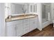 Bathroom featuring double sinks, granite countertops, and white cabinetry at 9445 N 94Th Pl # 212, Scottsdale, AZ 85258