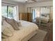 Bedroom with large bed, mirrored closet, and outdoor balcony view at 9445 N 94Th Pl # 212, Scottsdale, AZ 85258