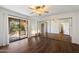 Large bedroom with mirrored closet doors, ceiling fan, and sliding glass door to a balcony at 9445 N 94Th Pl # 212, Scottsdale, AZ 85258