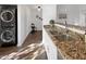 Bright kitchen features granite counters, stainless faucet, and sleek, modern appliances at 9445 N 94Th Pl # 212, Scottsdale, AZ 85258
