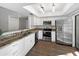 Bright kitchen features granite countertops, stainless steel appliances, and sleek white cabinetry at 9445 N 94Th Pl # 212, Scottsdale, AZ 85258