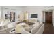 Bright living room with modern decor, balcony access, and hardwood floors at 9445 N 94Th Pl # 212, Scottsdale, AZ 85258