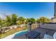 Enjoy outdoor living on this balcony that offers views of the pool and backyard landscaping at 11121 N 165Th Ave, Surprise, AZ 85388