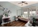 Cozy bedroom with natural light, a modern desk, and a comfortable, neutral decor at 11121 N 165Th Ave, Surprise, AZ 85388