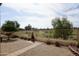 Tranquil backyard view overlooking a lush golf course, perfect for outdoor relaxation at 11564 W Mule Deer Ct, Surprise, AZ 85378