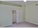 Bedroom with a sliding door closet and neutral carpet, offering a serene and comfortable space at 11564 W Mule Deer Ct, Surprise, AZ 85378