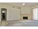 Open living room with fireplace, neutral colors, and ceiling fan provides a comfortable, relaxing space at 11564 W Mule Deer Ct, Surprise, AZ 85378