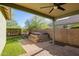 Covered patio shows a lush green backyard with a built in spa and metal fencing at 12711 W Lowden Rd, Peoria, AZ 85383