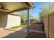 Covered patio shows a lush green backyard with a built in spa and metal fencing at 12711 W Lowden Rd, Peoria, AZ 85383