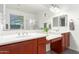 Double sinks, vanity, and natural light make this bathroom a calming space at 12711 W Lowden Rd, Peoria, AZ 85383