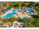 Expansive community pool area featuring multiple pools, splash pads, and a water slide for Gathering fun at 12711 W Lowden Rd, Peoria, AZ 85383