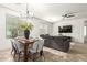 Open-concept dining area seamlessly connects to the living room, providing ample natural light and comfortable seating at 12711 W Lowden Rd, Peoria, AZ 85383