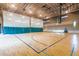 Enjoy a full-sized basketball court with hoops and bleachers inside of the community gymnasium at 12711 W Lowden Rd, Peoria, AZ 85383