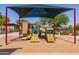 Shaded playground with multiple slides and climbing structures is ready for outdoor fun at 12711 W Lowden Rd, Peoria, AZ 85383