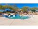 Inviting community pool with water slides and playful features perfect for Gathering enjoyment at 12711 W Lowden Rd, Peoria, AZ 85383