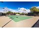 Well-maintained tennis court has fresh paint, new netting, and night lighting at 12711 W Lowden Rd, Peoria, AZ 85383