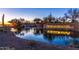 Beautiful community entrance with lush landscaping, water features, and elegant signage at 12711 W Lowden Rd, Peoria, AZ 85383