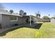 Exterior yard showing covered porch, grassy area, and brick wall at 15218 N 37Th Ave, Phoenix, AZ 85053