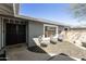 Inviting outdoor space with neutral toned chairs and pea gravel for relaxing and entertaining at 15218 N 37Th Ave, Phoenix, AZ 85053