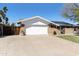 Charming single-story home with a spacious two-car garage, solar panels and well-maintained lawn at 15218 N 37Th Ave, Phoenix, AZ 85053