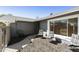 Inviting front courtyard with seating, walkway, and mature landscaping for a peaceful outdoor living at 15218 N 37Th Ave, Phoenix, AZ 85053