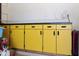 Garage storage cabinet with yellow doors at 15218 N 37Th Ave, Phoenix, AZ 85053