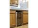 A convenient Avalon Bay wine fridge is built into the cabinetry of this kitchen, for chilling your wine to the perfect temperature at 15218 N 37Th Ave, Phoenix, AZ 85053