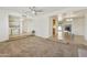 Spacious living room with carpet flooring, neutral walls, and ample natural light at 15218 N 37Th Ave, Phoenix, AZ 85053